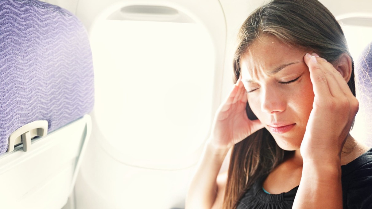 Fear of flying woman in plane airsick