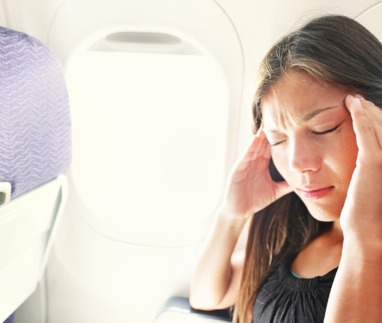 Fear of flying woman in plane airsick