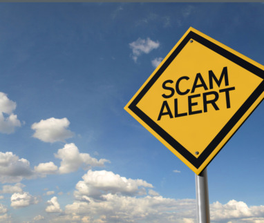 Scam alert yellow highway road sign