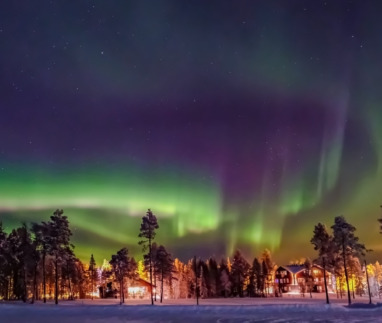 Aurora borealis (also known like northern or polar lights) beyond the Arctic Circle in winter Lapland.