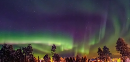 Aurora borealis (also known like northern or polar lights) beyond the Arctic Circle in winter Lapland.