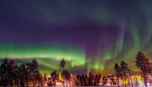 Aurora borealis (also known like northern or polar lights) beyond the Arctic Circle in winter Lapland.