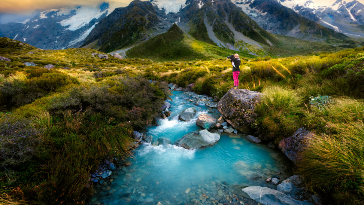 View of MT COOK in summer takes photo by woman traveler photographer, the nature landscape photo on unique and populars famous place for tourist visit in summer season of South Island of New Zealand