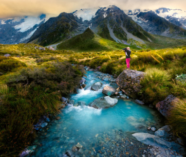 View of MT COOK in summer takes photo by woman traveler photographer, the nature landscape photo on unique and populars famous place for tourist visit in summer season of South Island of New Zealand