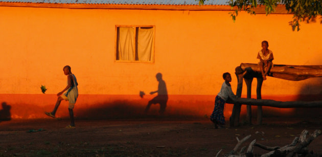 Playing football at sun set