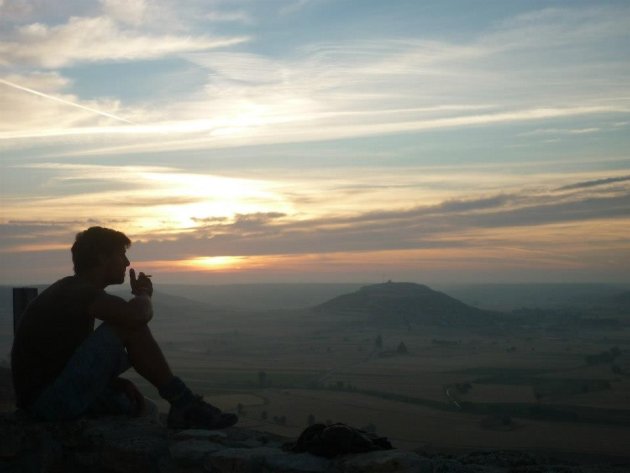 Contemplating pilgrim by sunrise